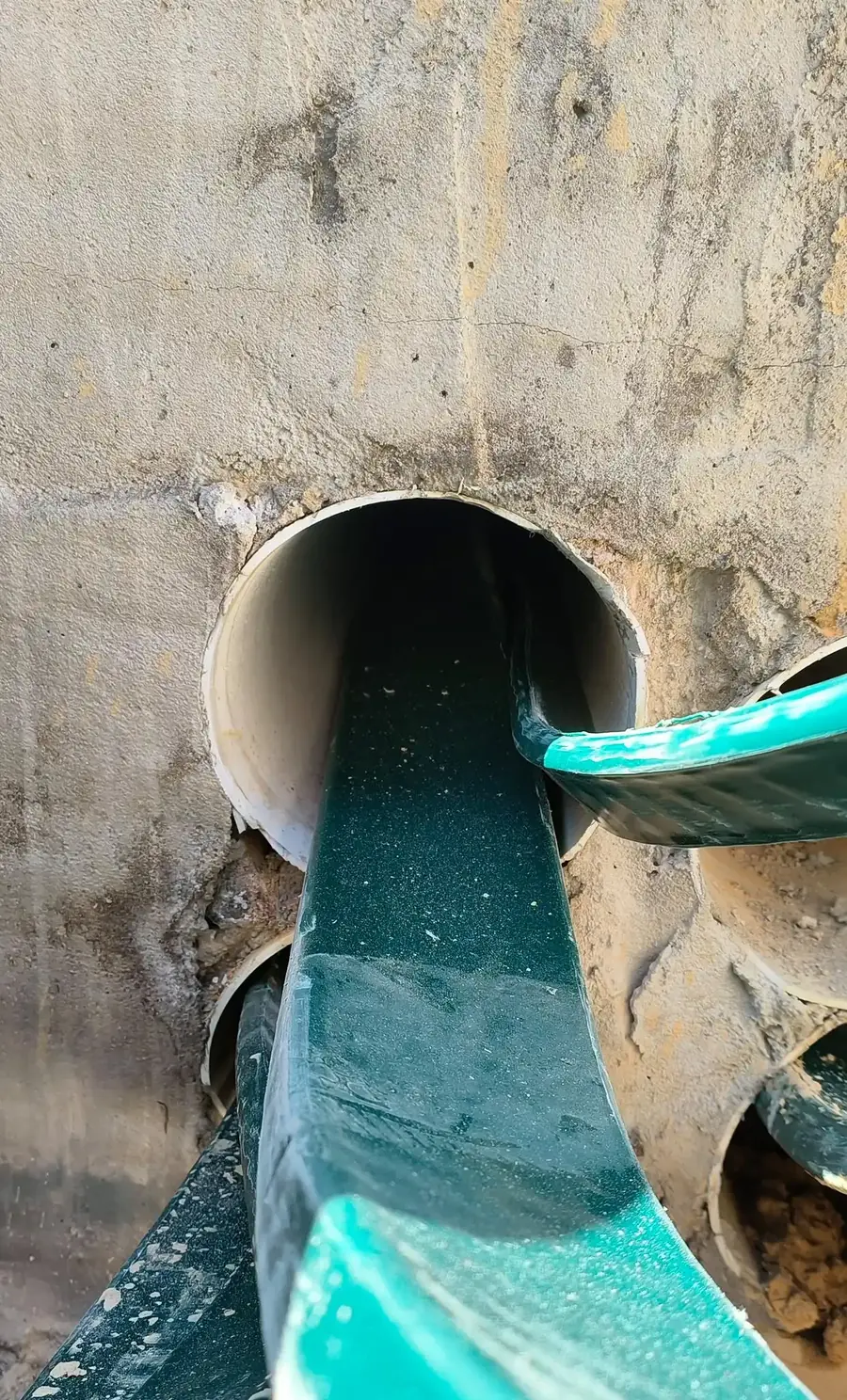 Cable passing through a wall sleeve into the next room