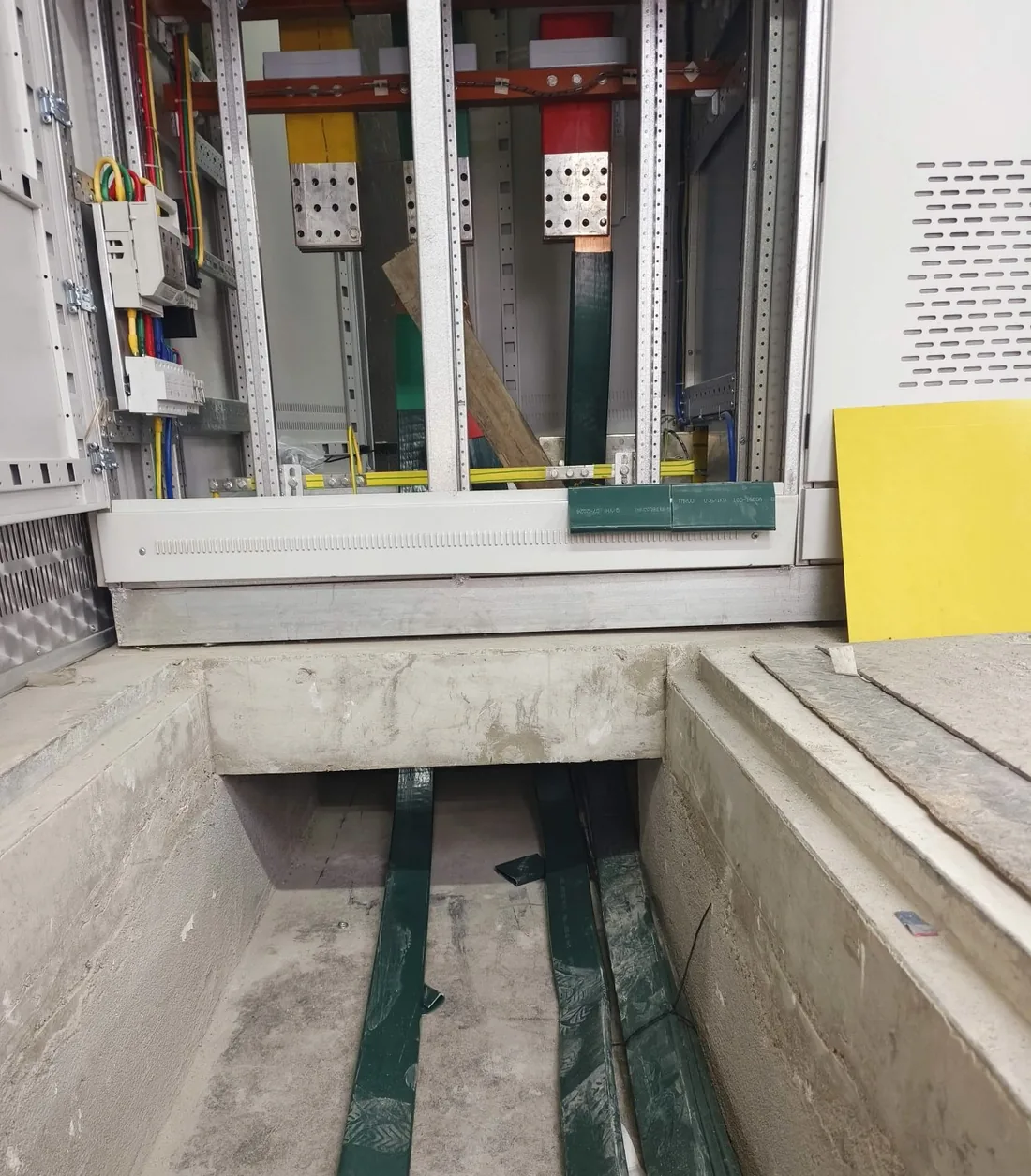 Cable laid in an open cable trench between switchgear bays