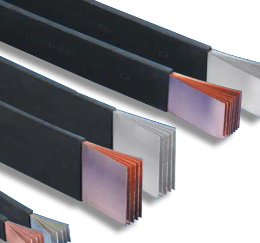 Exposed ends of an insulated laminated busbar showing the stacked copper plates